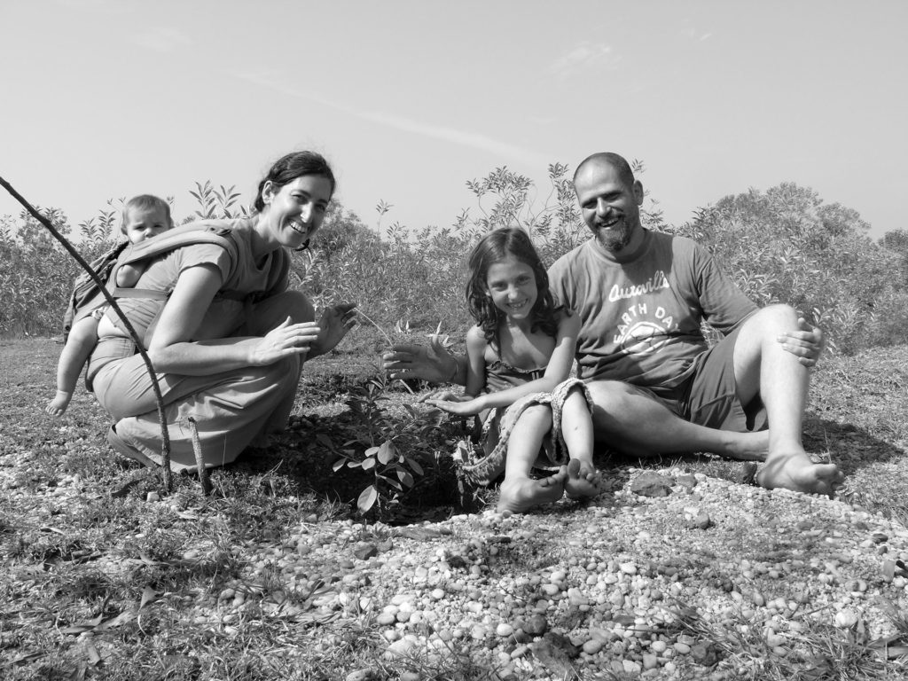 Aviram Family Sadhna Forest founder of Sadhana Forest, Aviram Rozin with his family, Yorit Rozin, Aviram and Yorit Rozin, planting trees, alternative living, Sadhana Forest, Auroville, living in a commune, community living, communities, reforestation, water conservation methods, forest, Pondicherry, Puducherry, Tamil Nadu, India, South India, experiences in Auroville, environment, environmental protection, environmental awareness, eco travel, green travel, save the earth, green planet, voluntourism, volunteer opportunities, social causes, social change, carbon footprint, self sustainability, travel