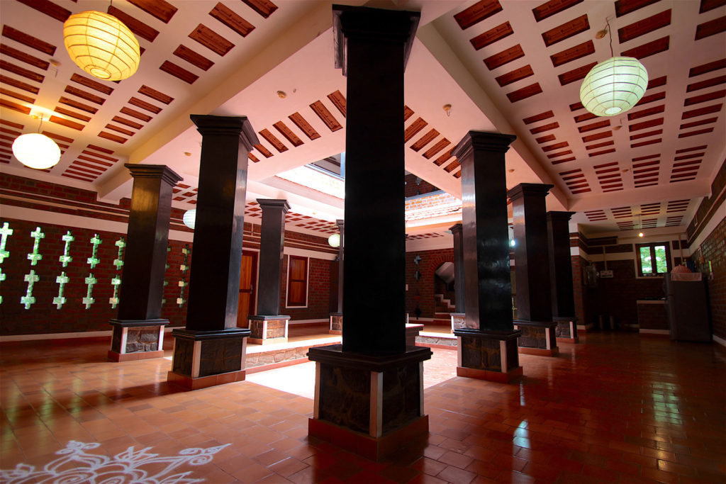 Interior of heritage guest house at Adishakti Theatre heritage guest house at Adishakti Theatre, interior of guest house, accommodation in Pondicherry, Adishakti, Adishakti, Adishakti Theatre, theatre commune, theatre community, living in a commune, traditional Indian architecture, traditional Indian courtyard, Laurie Baker mud construction, alternate travel, hotels, performing arts, theatre, experimental theatre, plays, music, theatre workshop, music workshop, arts, Pondicherry, Puducherry, Villupuram District, Tamil Nadu, India, South India, culture, eco travel, green travel, voluntourism, volunteer opportunities, self-sustaining communities, travel